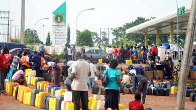 Nigerians buying fuel